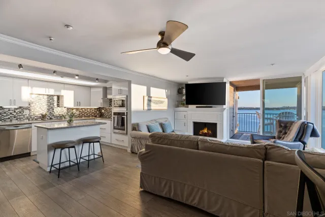 a living room with fireplace furniture and a flat screen tv
