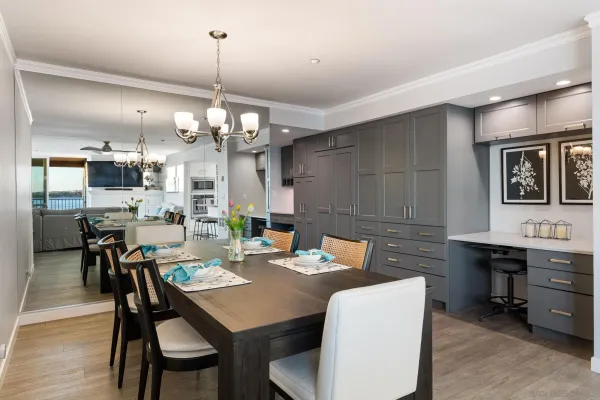 a view of a hallway view with living room and wooden floor