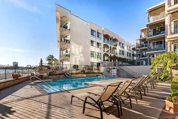 a view of a chairs and table in the balcony