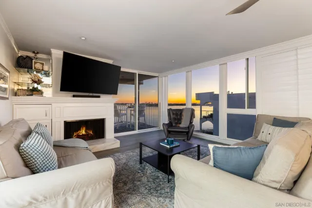 a living room with furniture fireplace and a flat screen tv
