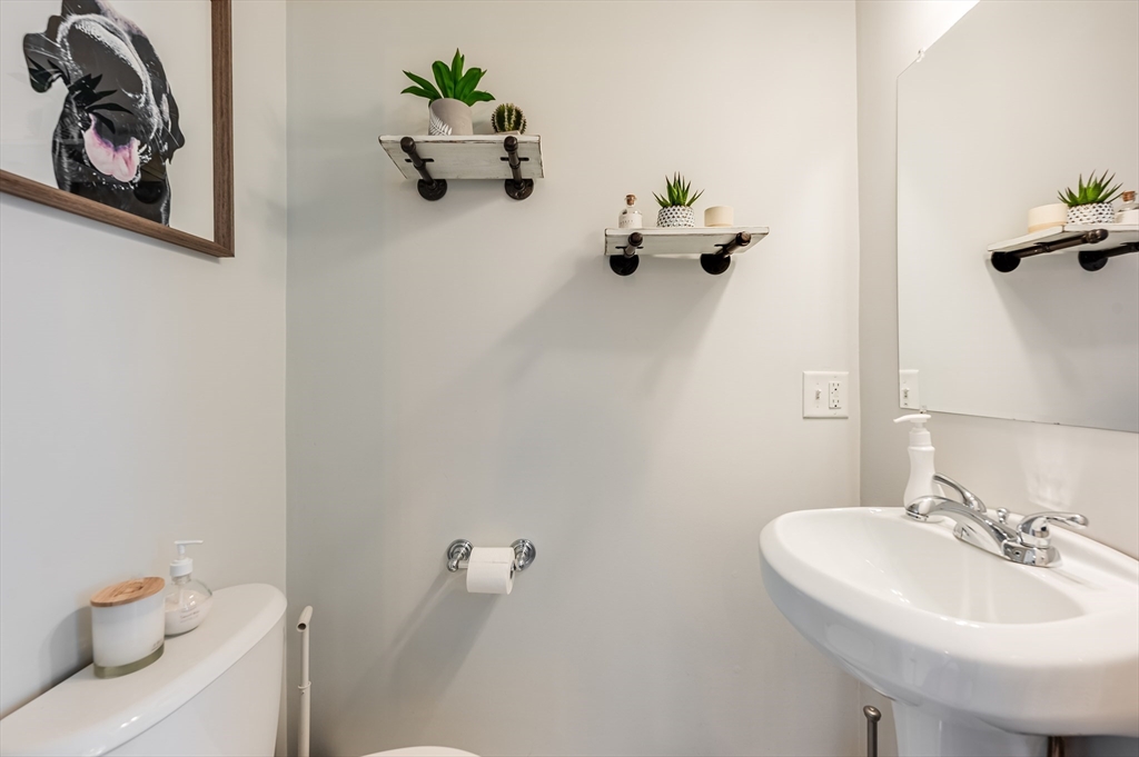 46 Rutherford Avenue Boston, MA 02129 - Photo 13 of 33 a bathroom with a sink a toilet and a mirror