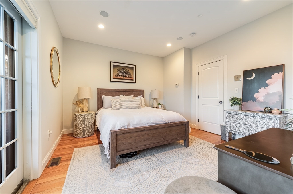 46 Rutherford Avenue Boston, MA 02129 - Photo 15 of 33 a spacious bedroom with a bed and a couch