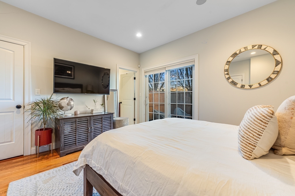 46 Rutherford Avenue Boston, MA 02129 - Photo 16 of 33 a bedroom with a bed and a flat screen tv