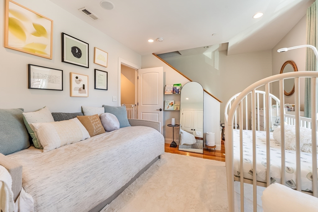 46 Rutherford Avenue Boston, MA 02129 - Photo 18 of 33 a spacious bedroom with a large bed and a couch