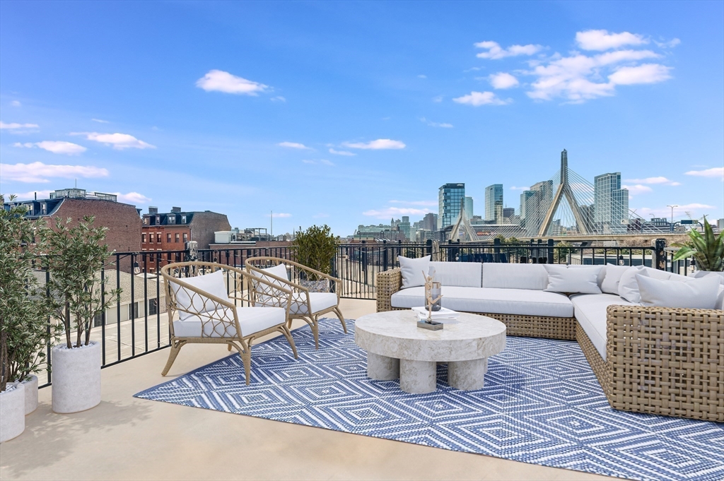 46 Rutherford Avenue Boston, MA 02129 - Photo 26 of 33 a view of a terrace with couches and potted plants