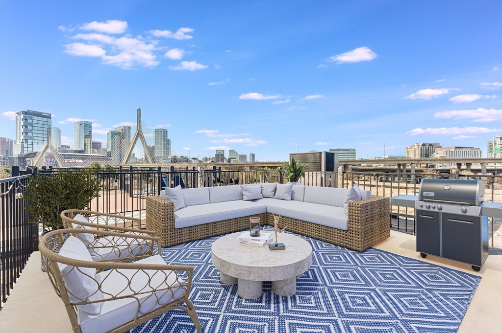 46 Rutherford Avenue Boston, MA 02129 - Photo 27 of 33 a view of a rooftop couch and chairs
