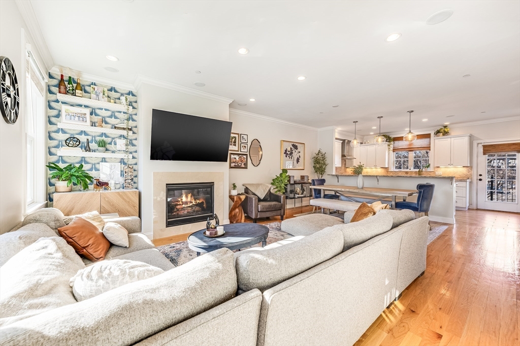46 Rutherford Avenue Boston, MA 02129 - Photo 5 of 33 a living room with furniture a fireplace and a flat screen tv