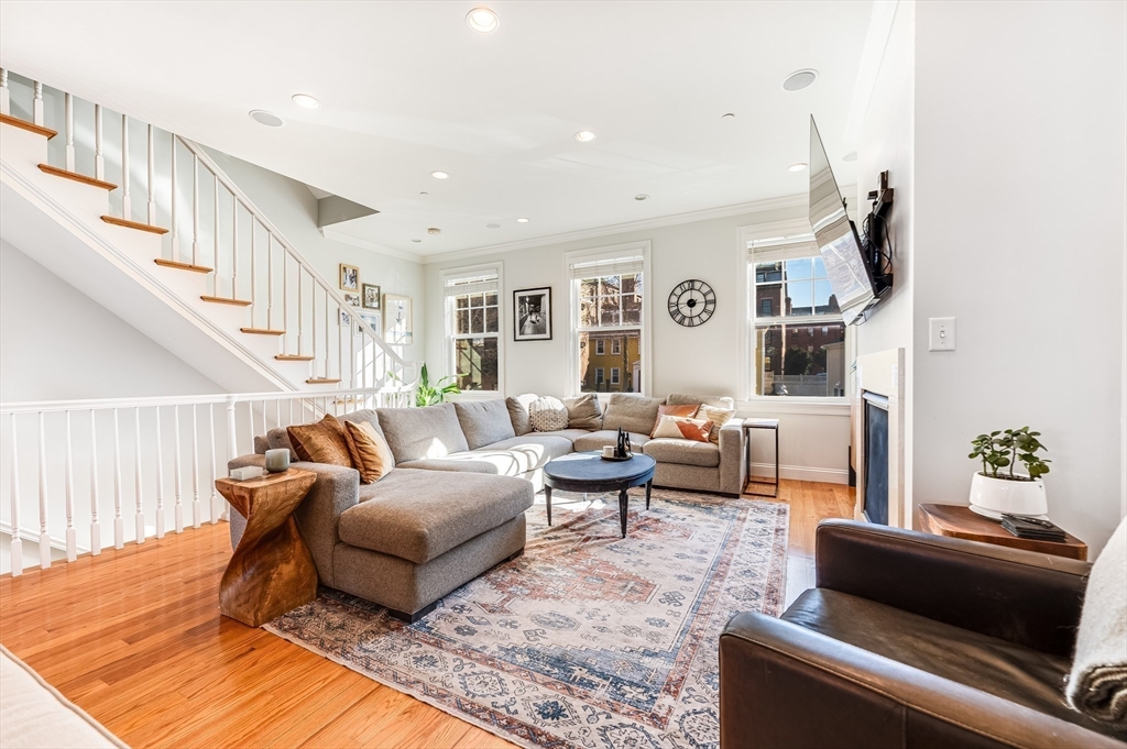 46 Rutherford Avenue Boston, MA 02129 - Photo 6 of 33 a living room with furniture kitchen view and a rug