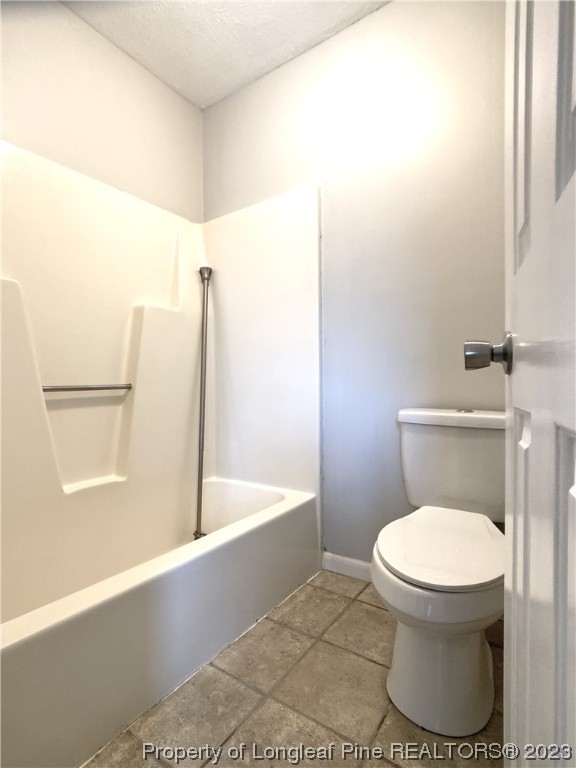 5686 Castleton Drive Hope Mills, NC 28348 - Photo 14 of 21 a bathroom with a toilet and a bathtub
