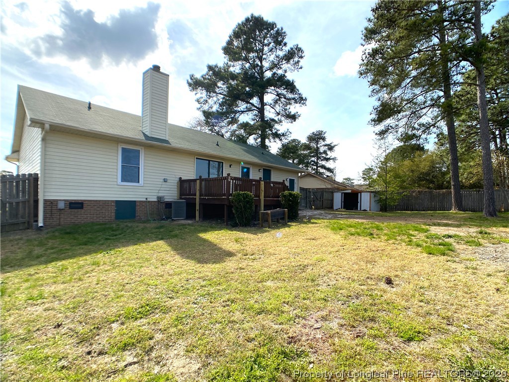 5686 Castleton Drive Hope Mills, NC 28348 - Photo 20 of 21 a view of a house with a yard