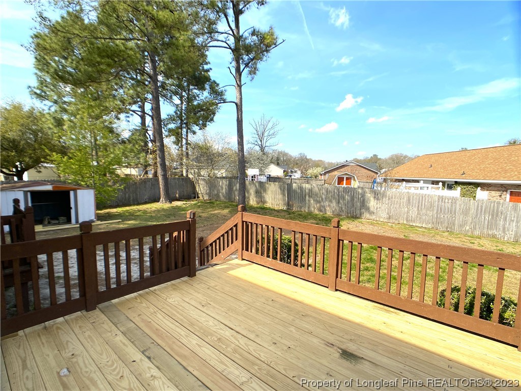5686 Castleton Drive Hope Mills, NC 28348 - Photo 21 of 21 a view of a balcony with wooden floor and fence