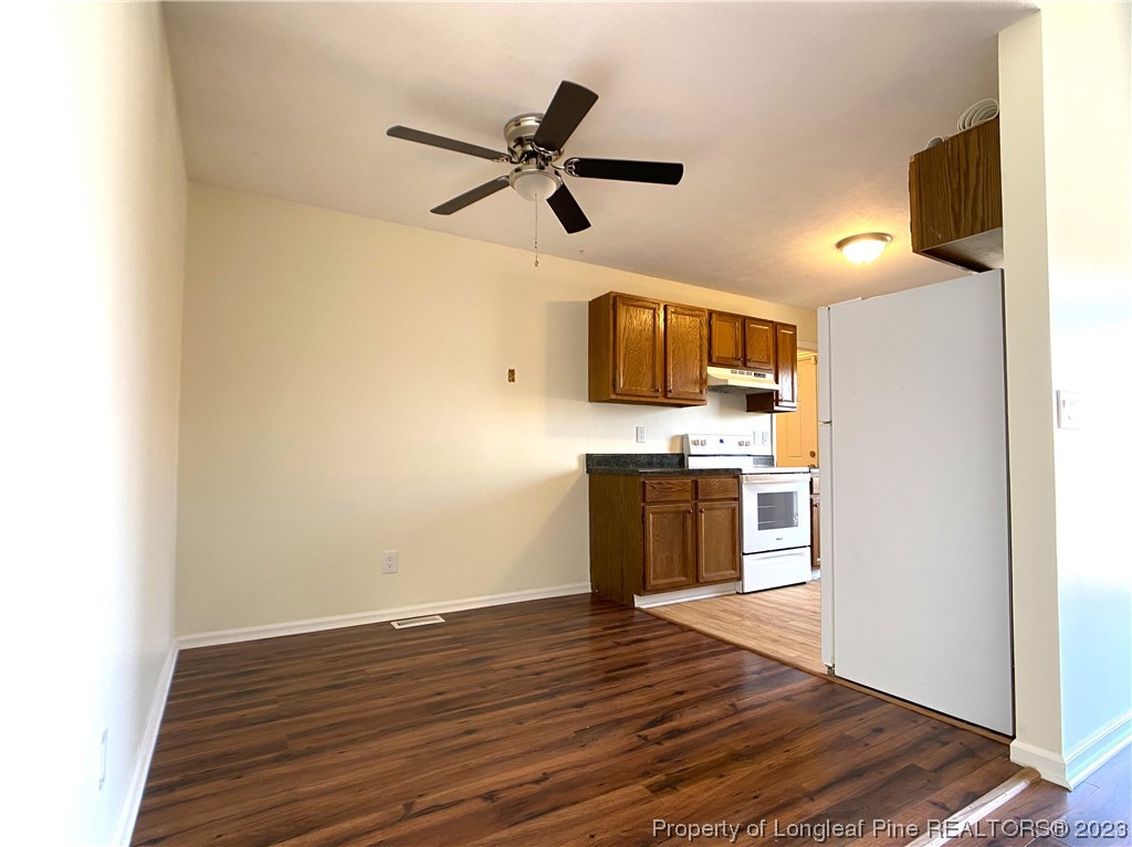 5686 Castleton Drive Hope Mills, NC 28348 - Photo 5 of 21 a view of a kitchen with a sink wooden floor and a window
