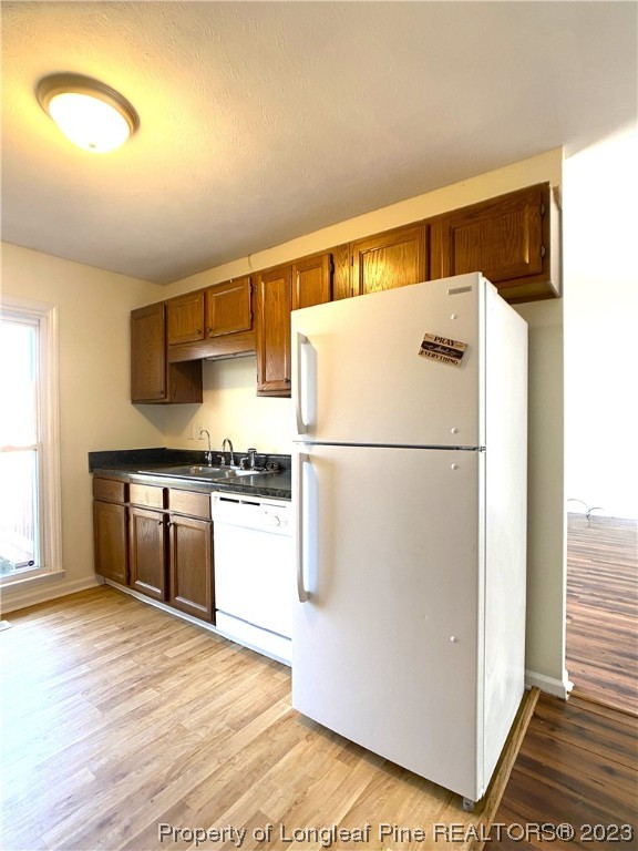 5686 Castleton Drive Hope Mills, NC 28348 - Photo 8 of 21 a kitchen with a refrigerator and a stove top oven