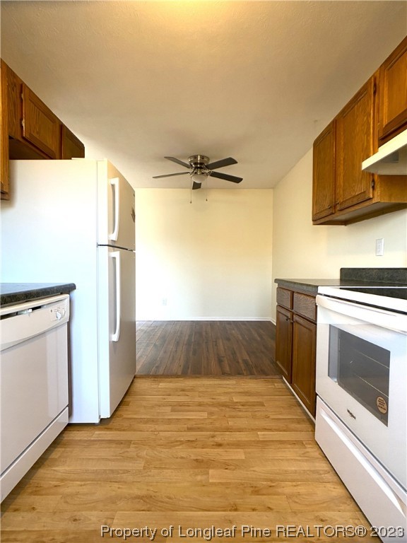 5686 Castleton Drive Hope Mills, NC 28348 - Photo 9 of 21 a kitchen with a refrigerator and a stove top oven