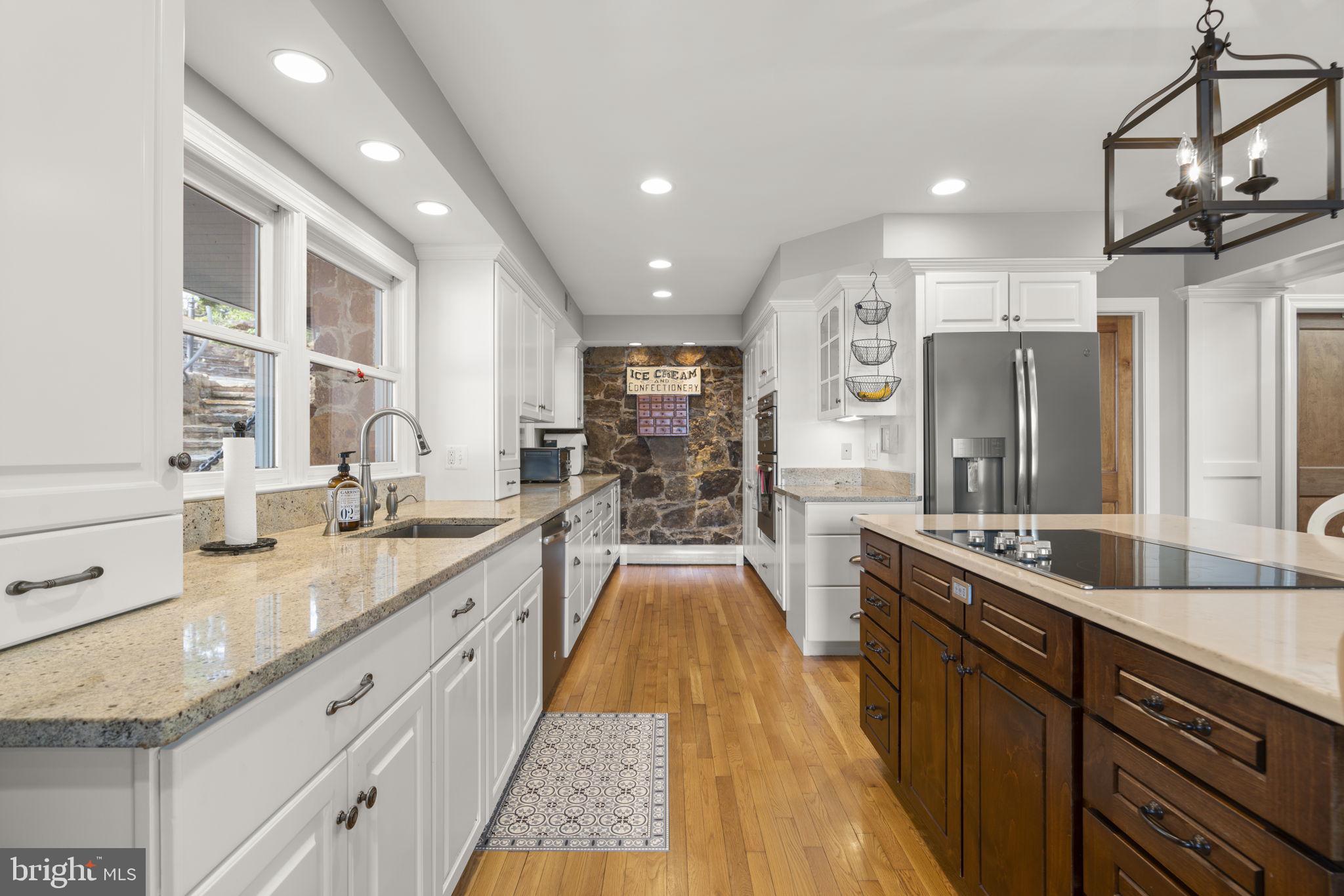 674 Hendler Road Severna Park, MD 21146 - Photo 11 of 48 a large kitchen with stainless steel appliances granite countertop a lot of counter space and a sink