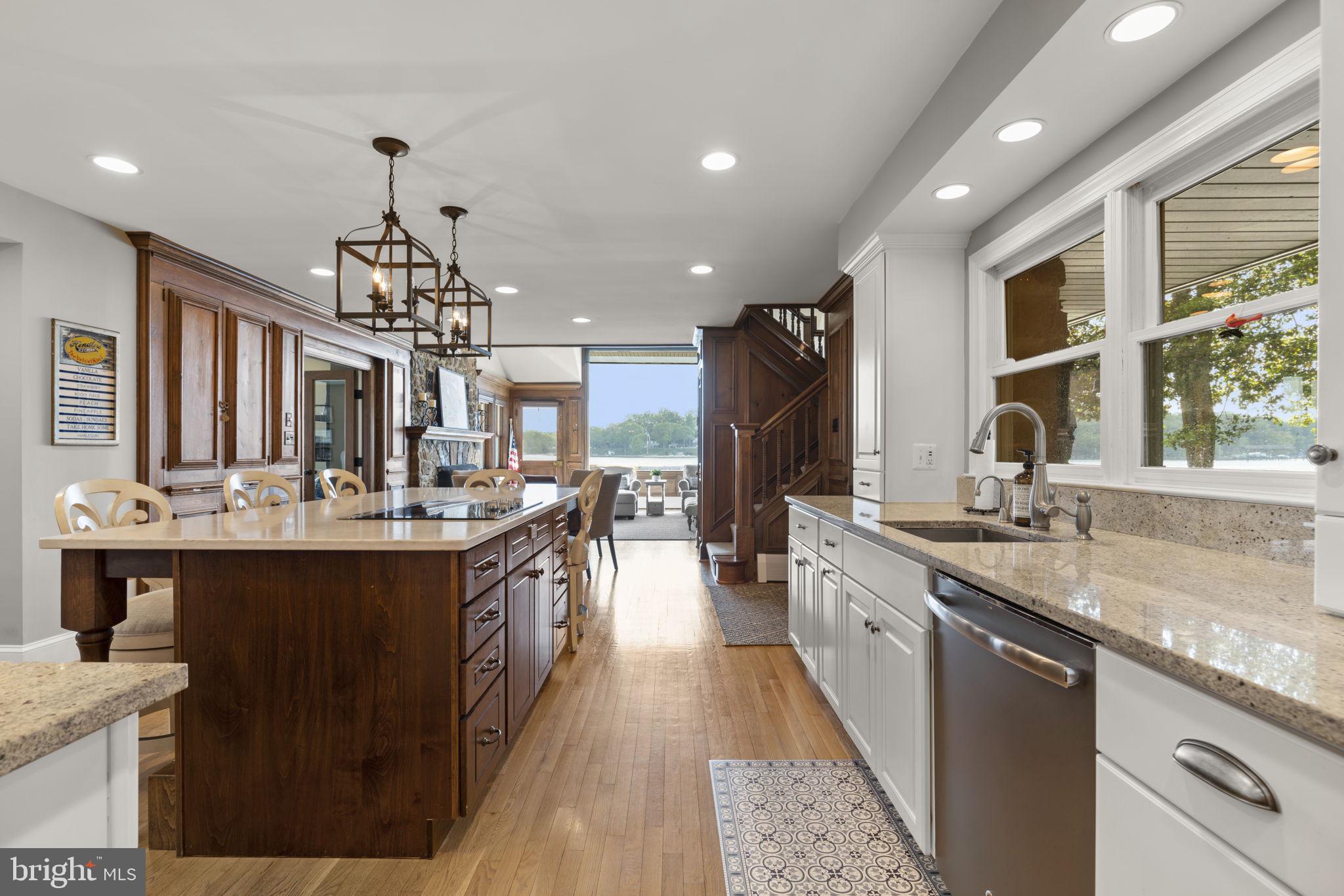 674 Hendler Road Severna Park, MD 21146 - Photo 12 of 48 a very nice looking kitchen with a center island wooden floor stainless steel appliances and cabinets