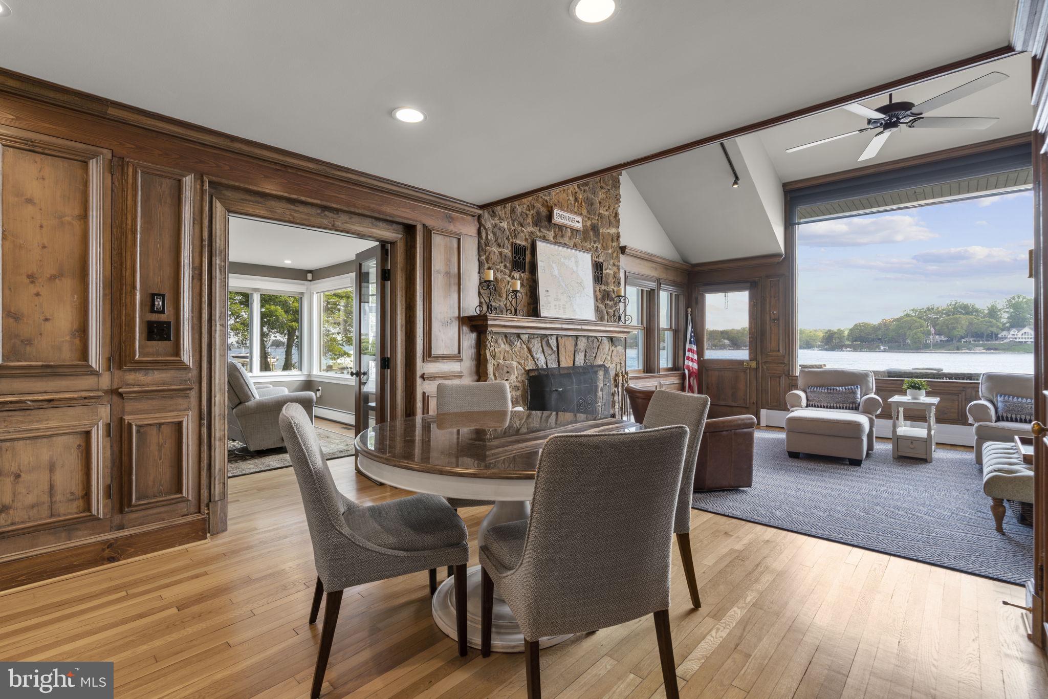 674 Hendler Road Severna Park, MD 21146 - Photo 13 of 48 a dining room with furniture a chandelier and wooden floor