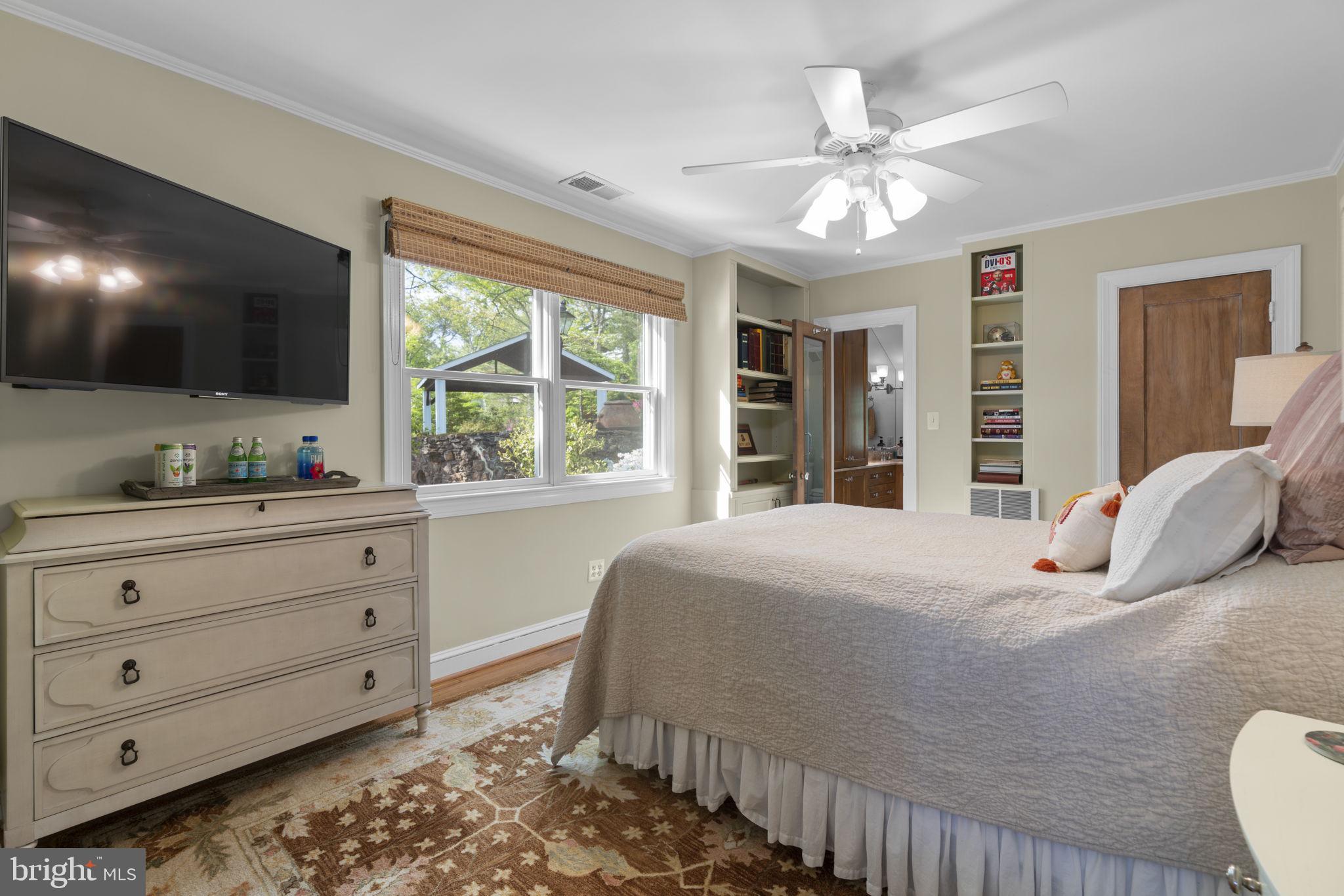674 Hendler Road Severna Park, MD 21146 - Photo 19 of 48 a bedroom with a large bed and a window
