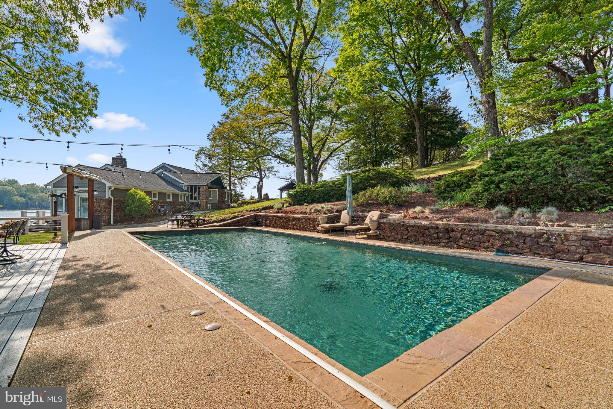 674 Hendler Road Severna Park, MD 21146 - Photo 30 of 48 a view of a swimming pool with a yard