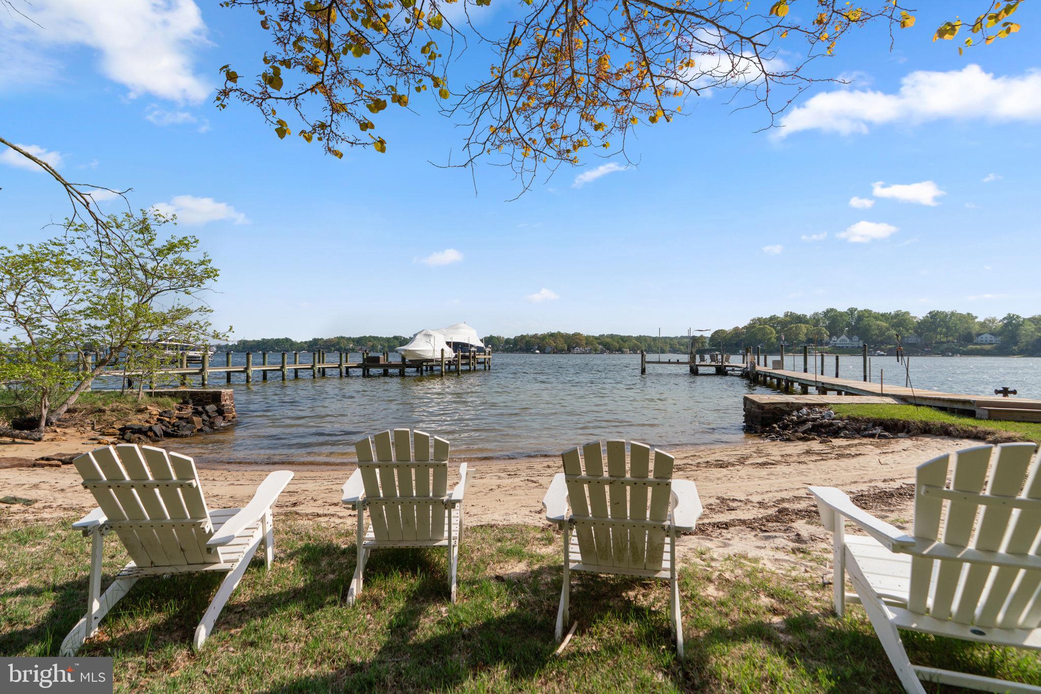 674 Hendler Road Severna Park, MD 21146 - Photo 34 of 48 a view of a lake with couches in the patio