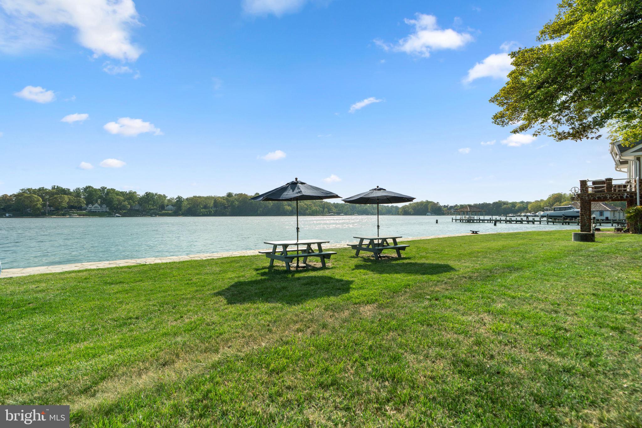 674 Hendler Road Severna Park, MD 21146 - Photo 35 of 48 a view of a lake with houses in the back