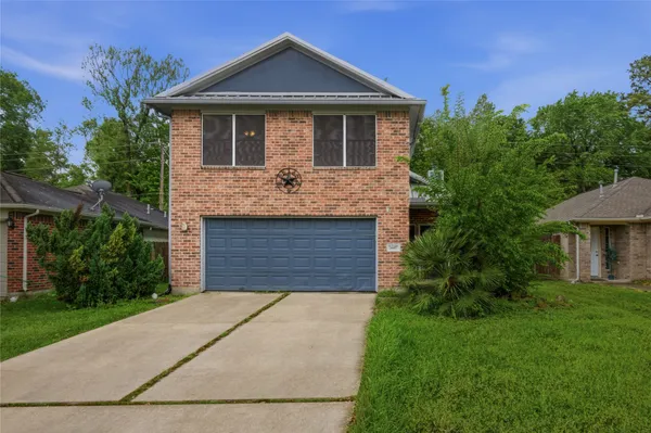 a front view of a house with yard