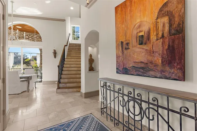 a view of an entryway with wooden floor