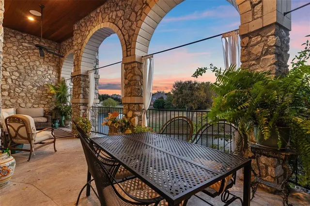 a view of balcony with furniture