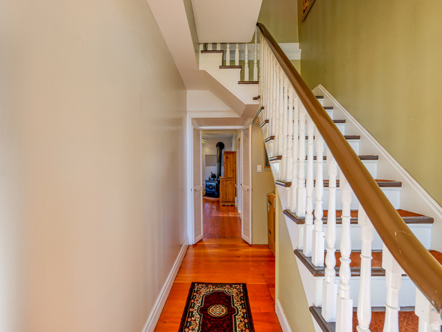 155 West Center Street Fillmore, UT 84631 - Photo 21 of 86 Hardwood flooring in a rich cherry finish extending through a hallway