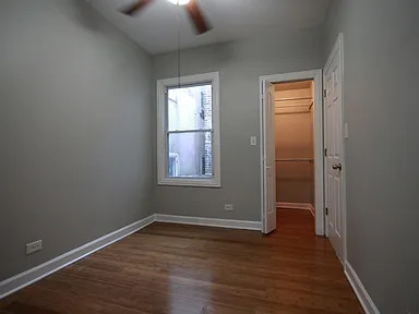 1922 West 47th Street, Unit 2 Chicago, IL 60609 - Photo 13 of 20 an empty room with wooden floor closet and windows