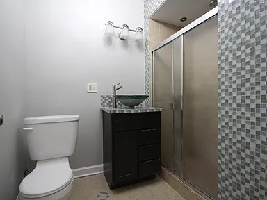 1922 West 47th Street, Unit 2 Chicago, IL 60609 - Photo 17 of 20 a bathroom with a toilet and a sink