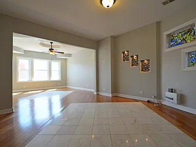 1922 West 47th Street, Unit 2 Chicago, IL 60609 - Photo 5 of 20 a view of an empty room with window and hardwood floor