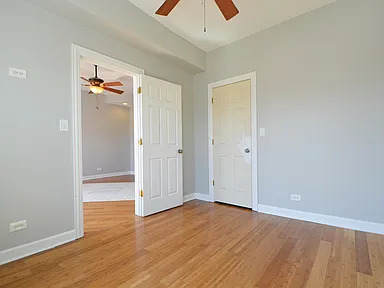 1922 West 47th Street, Unit 2 Chicago, IL 60609 - Photo 10 of 20 wooden floor in an empty room