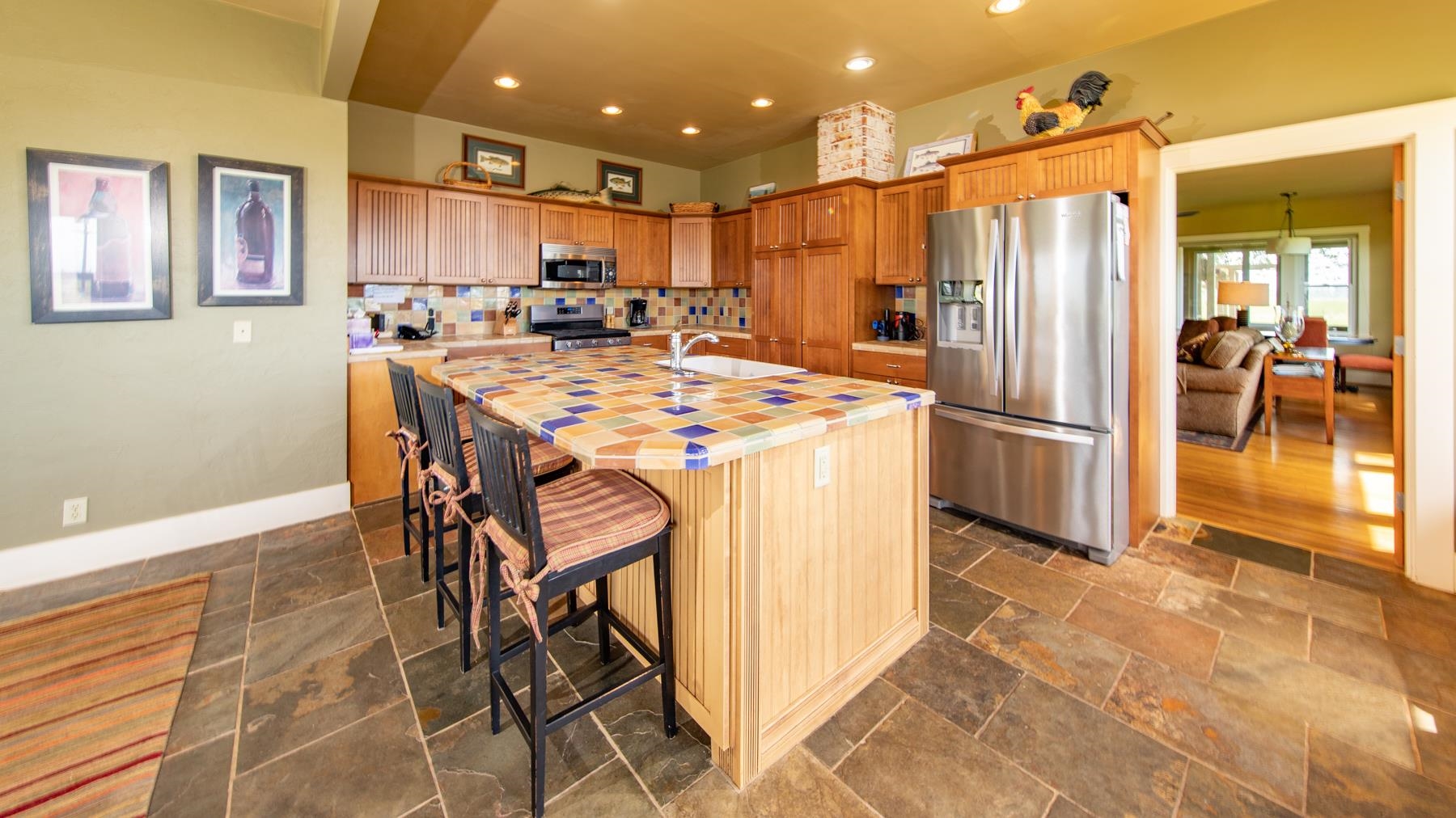 42369 Horr Road Fall River Mills, CA 96028 - Photo 11 of 21 a kitchen with stainless steel appliances granite countertop a refrigerator and a stove top oven