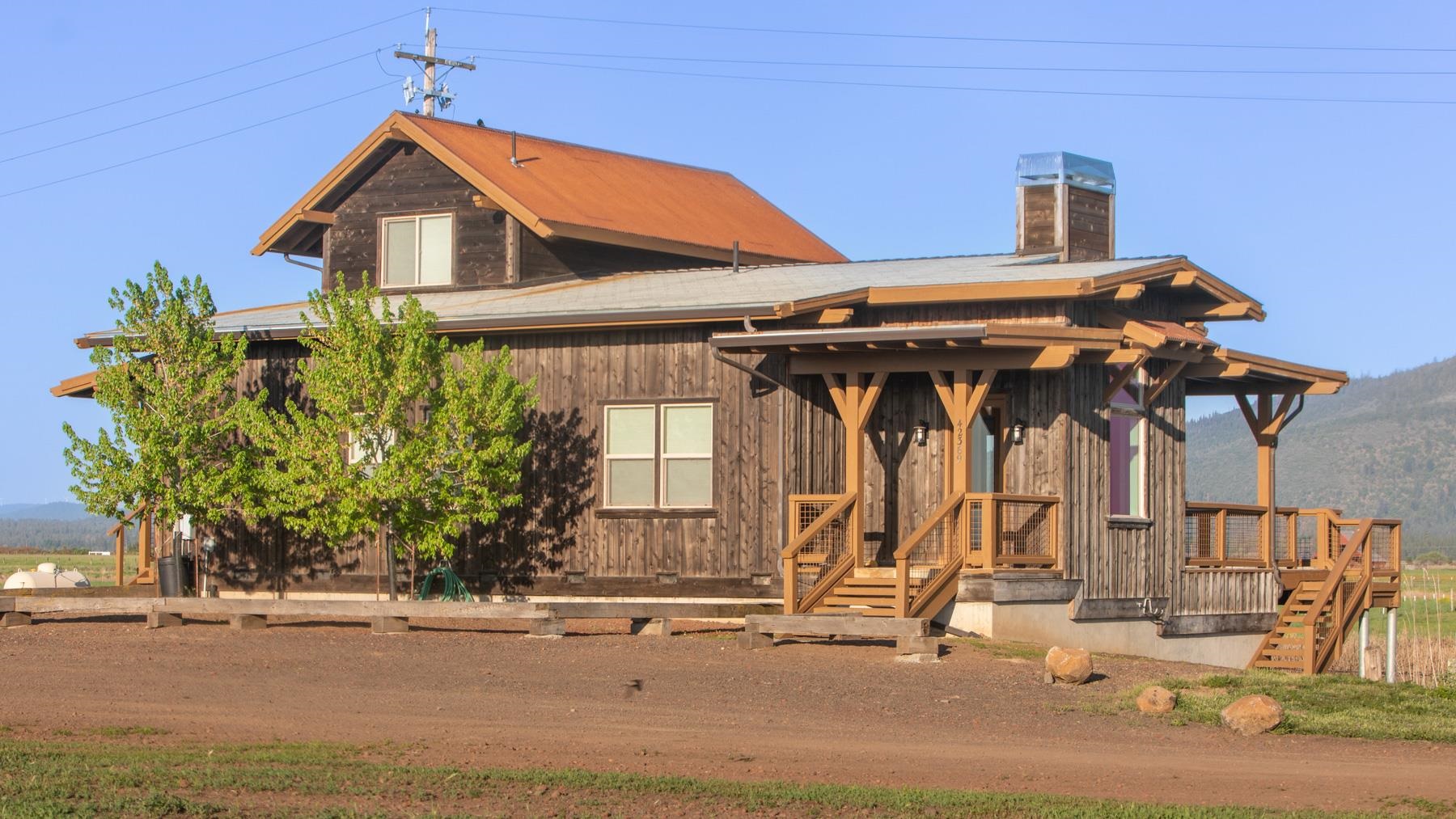 42369 Horr Road Fall River Mills, CA 96028 - Photo 14 of 21 a front view of a house with porch