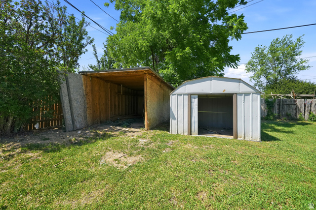546 West 200 South Payson, UT 84651 - Photo 28 of 45 Expansive backyard featuring a shed and an open-sided storage structure