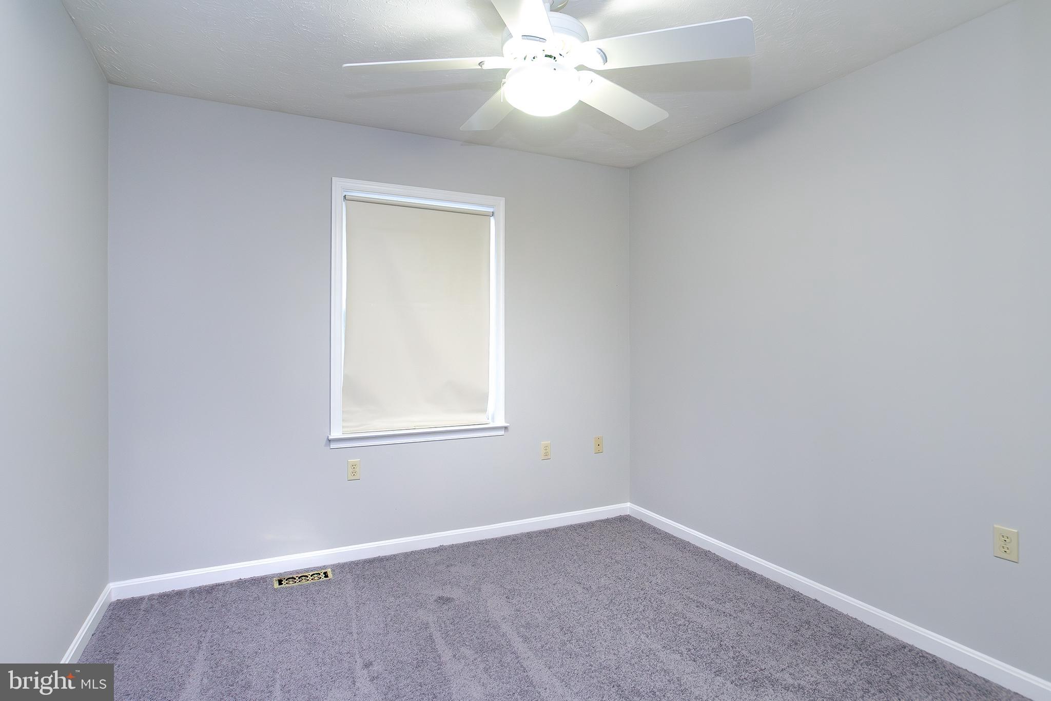 19930 Old York Road White Hall, MD 21161 - Photo 19 of 46 an empty room with a window and a fan