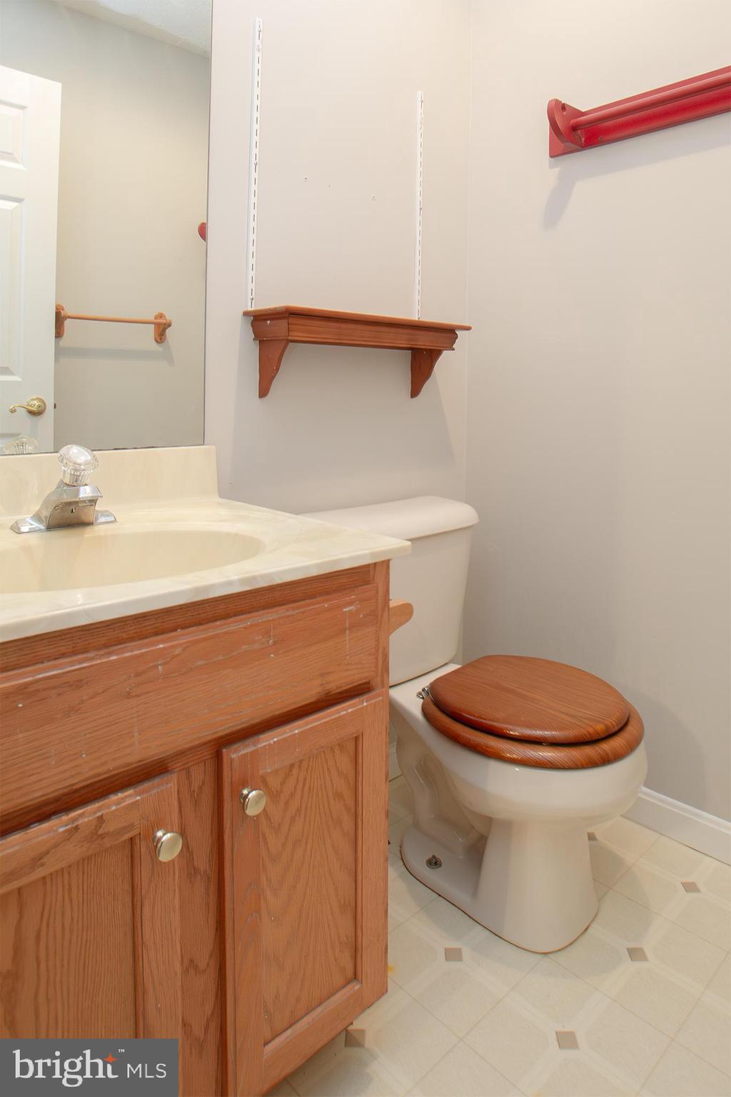 19930 Old York Road White Hall, MD 21161 - Photo 26 of 46 a bathroom with a sink a toilet and mirror