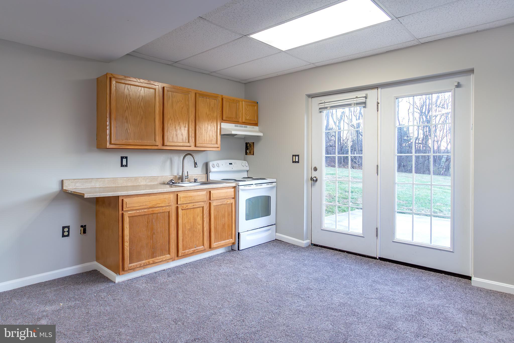 19930 Old York Road White Hall, MD 21161 - Photo 27 of 46 a kitchen with stainless steel appliances granite countertop a stove a sink and a microwave