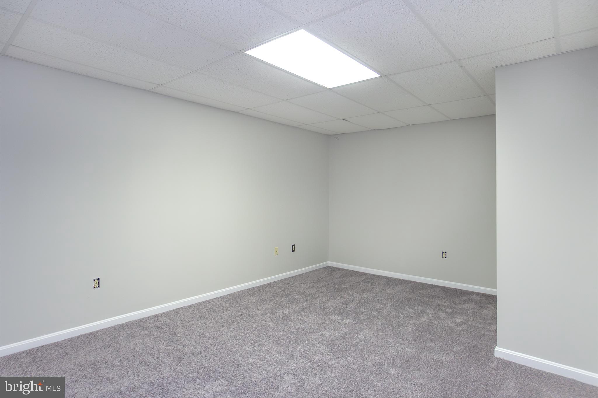 19930 Old York Road White Hall, MD 21161 - Photo 28 of 46 an empty room with a window and ceiling fan