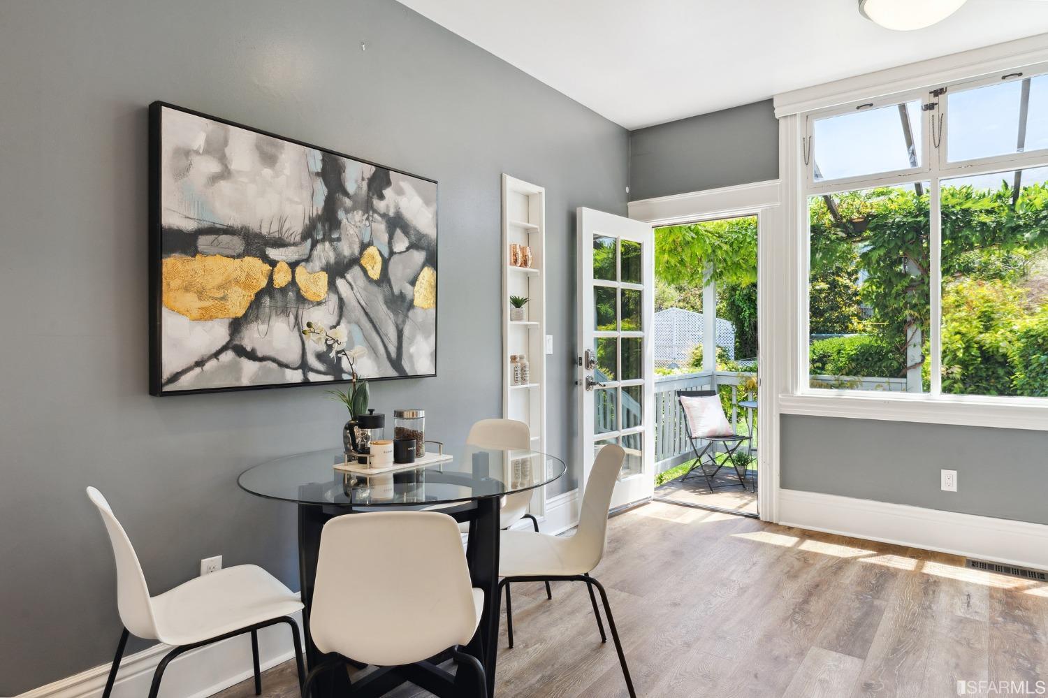 445 Clipper Street San Francisco, CA 94114 - Photo 13 of 62 a view of a dining room with furniture a chandelier and wooden floor