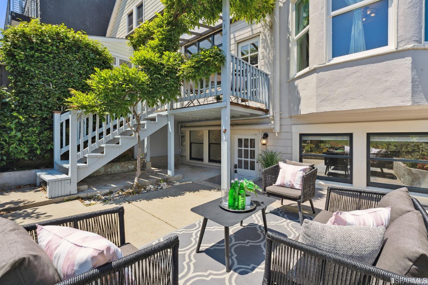 445 Clipper Street San Francisco, CA 94114 - Photo 19 of 62 a view of a house with backyard and sitting area