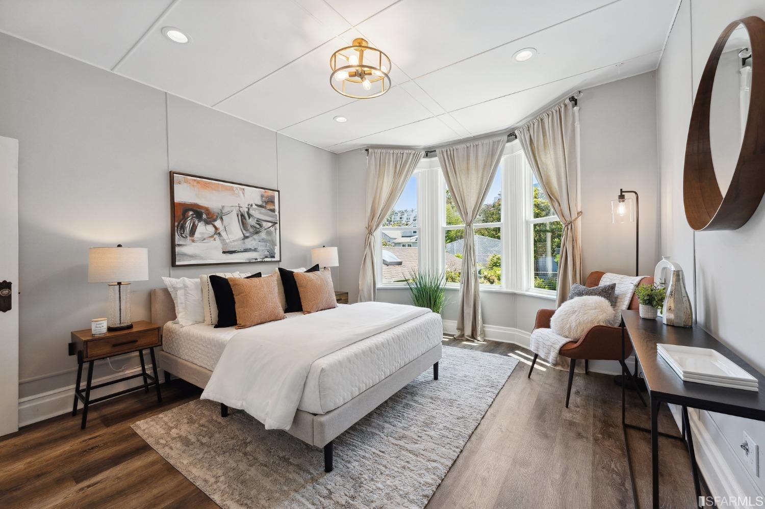 445 Clipper Street San Francisco, CA 94114 - Photo 23 of 62 a bedroom with a bed wooden floor and a large window