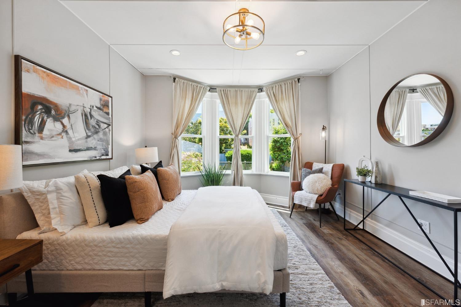 445 Clipper Street San Francisco, CA 94114 - Photo 24 of 62 a spacious bedroom with a bed and a large window