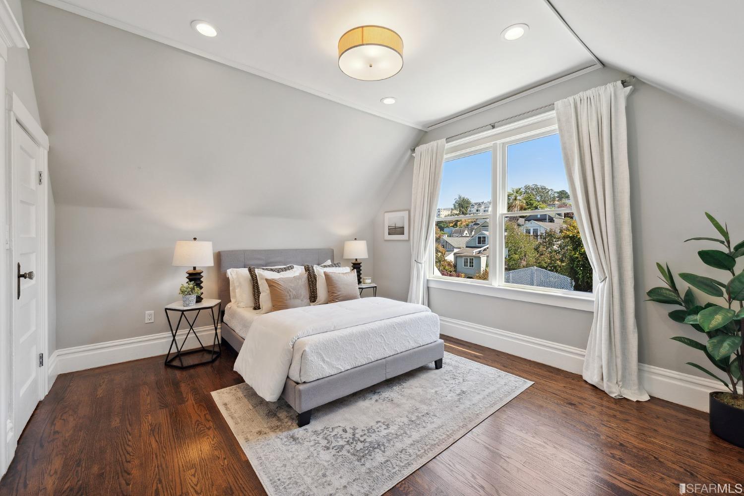 445 Clipper Street San Francisco, CA 94114 - Photo 30 of 62 a bedroom with a bed and a window