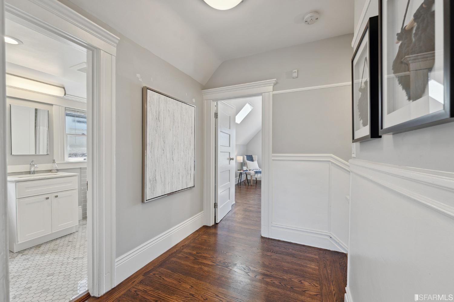 445 Clipper Street San Francisco, CA 94114 - Photo 33 of 62 a view of a hallway view with wooden floor and staircase