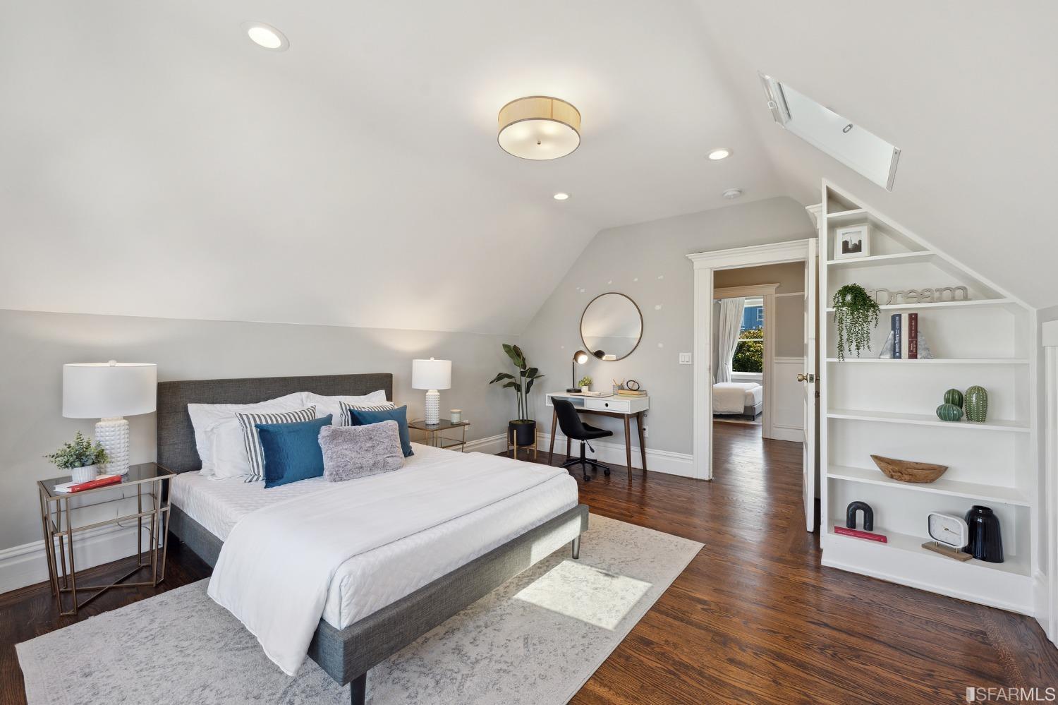 445 Clipper Street San Francisco, CA 94114 - Photo 37 of 62 a bedroom with a bed and wooden floor