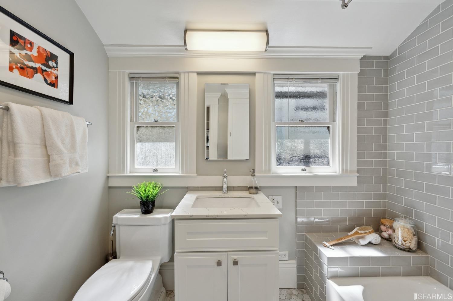 445 Clipper Street San Francisco, CA 94114 - Photo 38 of 62 a bathroom with a toilet sink and mirror