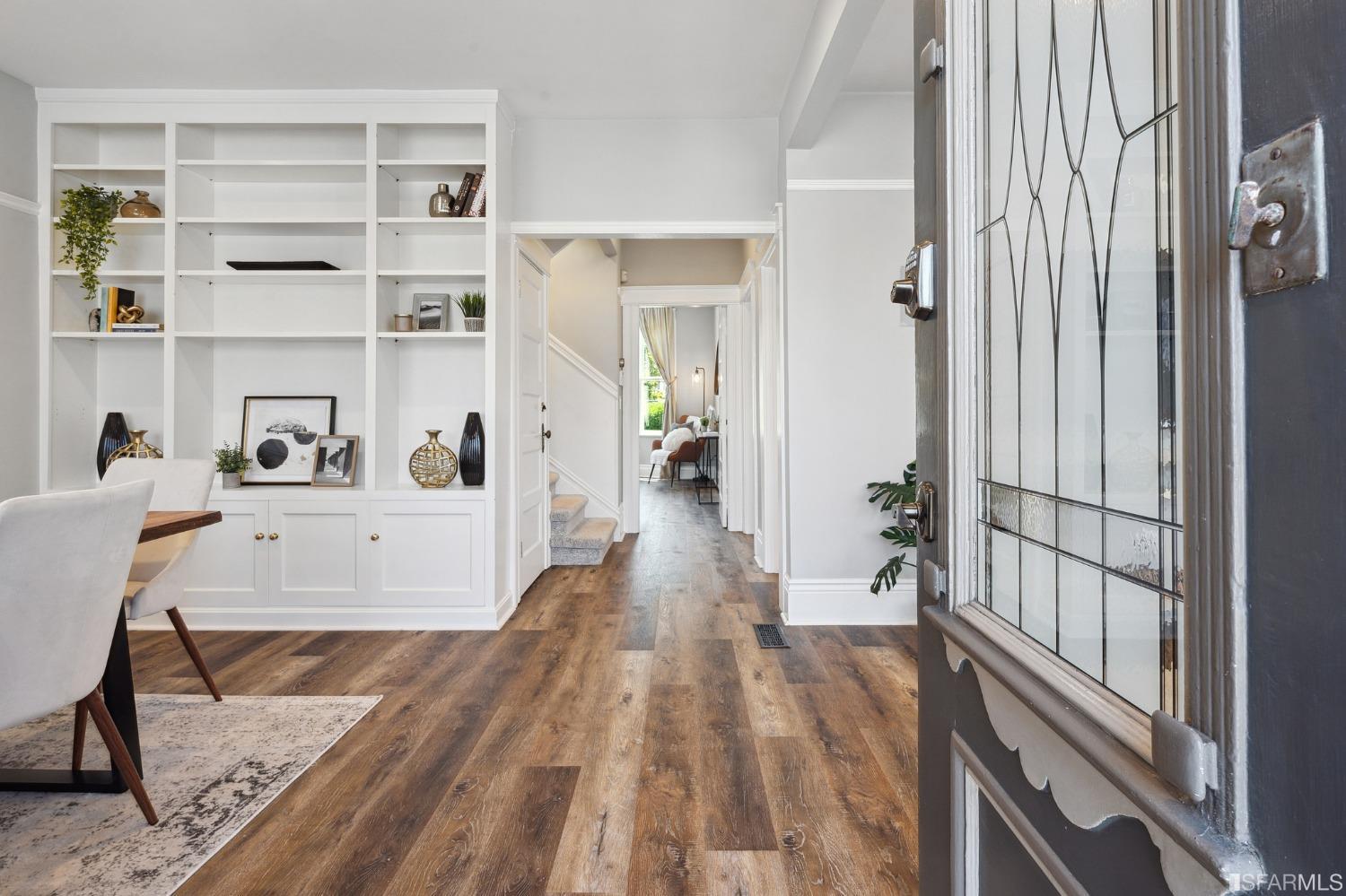 445 Clipper Street San Francisco, CA 94114 - Photo 4 of 62 a view of a hallway with wooden floor and a workspace