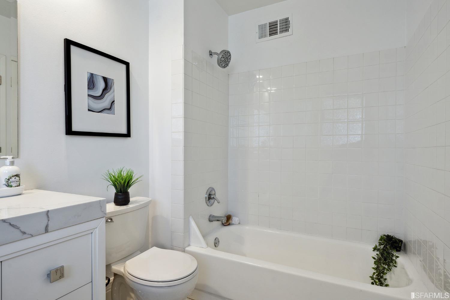 445 Clipper Street San Francisco, CA 94114 - Photo 55 of 62 a bathroom with a sink a toilet and bathtub